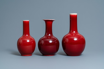 Three Chinese monochrome sang de boeuf-glazed bottle vases, 19/20th C.