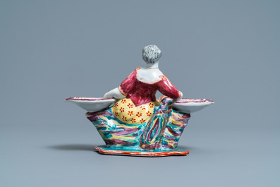 A Dutch Delft polychrome petit feu figural salt cellar, 18th C.