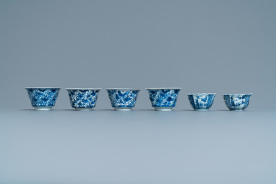 Six Chinese blue and white cups and saucers and eleven miniature vases, Kangxi