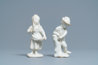 Two white Dutch Delftware figures of a boy and a girl, 18th C.