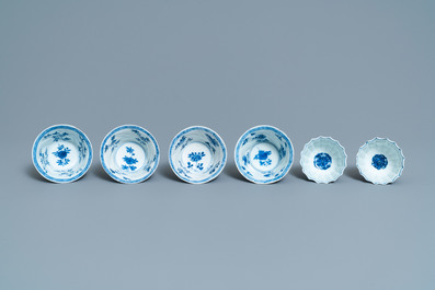 Six Chinese blue and white cups and saucers and eleven miniature vases, Kangxi