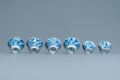 Six Chinese blue and white cups and saucers and eleven miniature vases, Kangxi