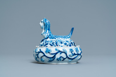 A Dutch Delft blue and white butter tub in the shape of a mermaid, 18th C.