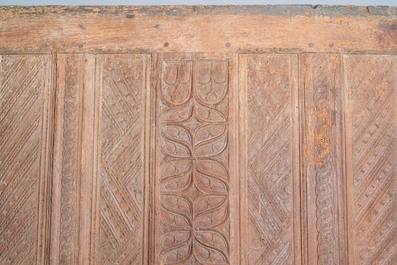 A carved oak front panel of a coffer with tracery panels and geometrical motives, Brittany, France, 17th C.