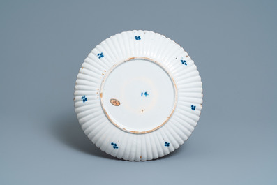 A ribbed Dutch Delft blue and white chinoiserie 'dragon' dish, 18th C.