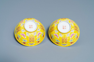 A pair of Chinese famille rose yellow-ground 'butterfly' bowls, Tongzhi mark, 20th C.