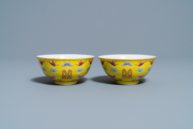 A pair of Chinese famille rose yellow-ground 'butterfly' bowls, Tongzhi mark, 20th C.