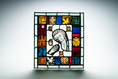 A composite stained and painted glass window mounted in lead alloy, France, 13th C. and later