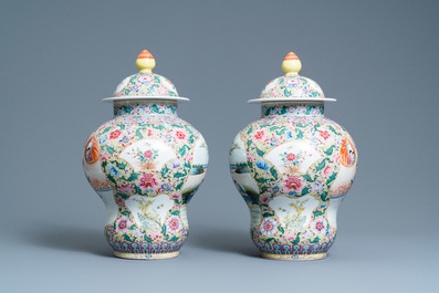 A pair of Chinese famille rose yellow-ground vases and covers, Qianlong mark, Republic