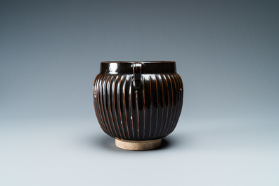 A Chinese black-glazed ribbed two-handled jar, Northern Song or Jin