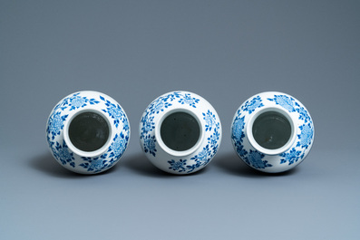 Three Chinese blue and white vases and covers, Kangxi mark, 19th C.