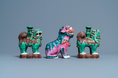 A Chinese famille rose model of a Buddhist lion and a pair of verte biscuit joss stick holders, 19th C.