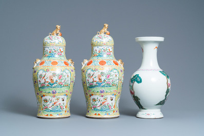 A pair of Chinese Canton famille rose yellow-ground vases and a 'warrior' vase, Qianlong mark, 19th C.