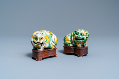 A pair of Chinese sancai models of dogs and a pair of 'Buddhist lions' joss stick holders, Kangxi