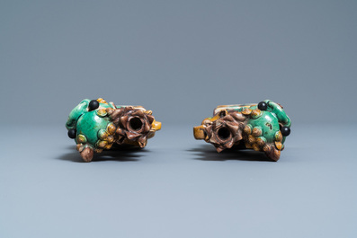 A pair of Chinese sancai models of dogs and a pair of 'Buddhist lions' joss stick holders, Kangxi