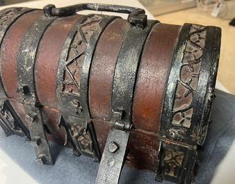 A partly red painted cast iron casket, France, 15th C.