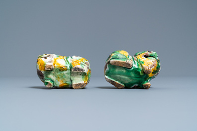 A pair of Chinese sancai models of dogs and a pair of 'Buddhist lions' joss stick holders, Kangxi