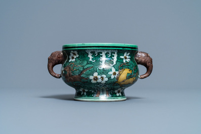 A Chinese verte biscuit 'flaming horses' censer, Jiajing mark, 18/19th C.