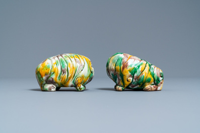 A pair of Chinese sancai models of dogs and a pair of 'Buddhist lions' joss stick holders, Kangxi