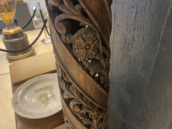 A pair of reticulated carved oak Corinthian columns with cherub heads and vines, 17th C.