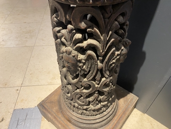 A pair of reticulated carved oak Corinthian columns with cherub heads and vines, 17th C.