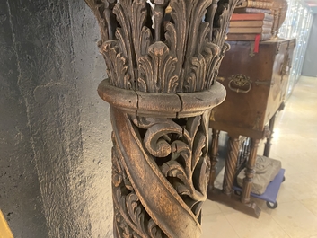 A pair of reticulated carved oak Corinthian columns with cherub heads and vines, 17th C.