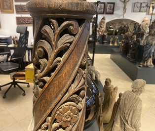 A pair of reticulated carved oak Corinthian columns with cherub heads and vines, 17th C.