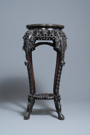 Two reticulated Chinese carved wooden stands, 19/20th C.