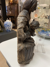 A patinated wooden group of Saint Anne with the infant Jesus on an inscribed base, ca. 1540