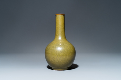 A Chinese monochrome teadust-glazed bottle vase, 19th C.