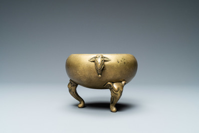 A Chinese bronze censer with elephant head handles and feet, Qianlong mark and of the period