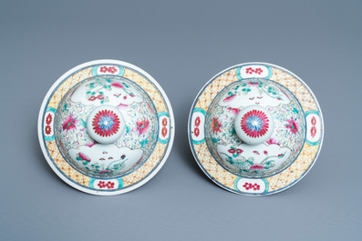 A pair of Chinese famille rose vases and covers, 19th C.