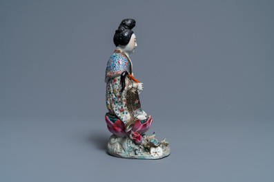 A Chinese famille rose figure of a lady on a lotus throne, 19th C.