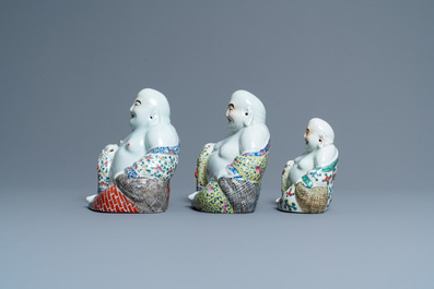 Five Chinese famille rose and white figures of Buddha, seal marks, 19/20th C.