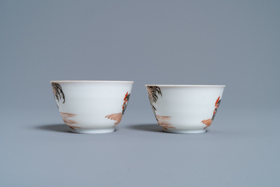 A pair of Chinese grisaille 'hen and rooster' cups and saucers, Yongzheng