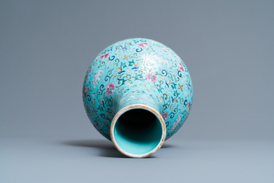 A Chinese famille rose turquoise-ground bottle vase, Qianlong mark, 19th C.