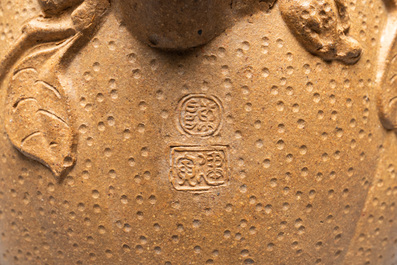 A Chinese Yixing stoneware teapot with squirrels and butterflies, seal mark, 18th C.