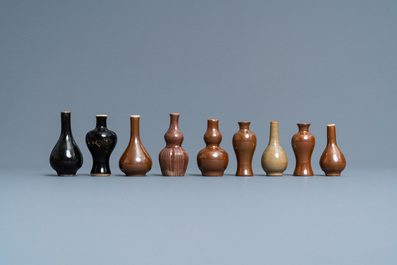 Thirty-eight Chinese blue and white, famille rose and monochrome miniature vases, Kangxi/Qianlong