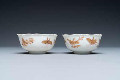 Three Chinese iron-red and gilt 'butterfly' saucers and two cups, Yongzheng