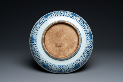 A Chinese blue and white 'lotus bouquet' dish, Qianlong/Jiaqing