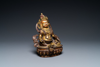 Une figure de Jambhala en bronze partiellement dor&eacute; au dos inscrit, Sino-Tibet, 19&egrave;me