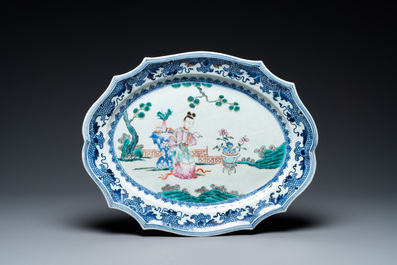 A pair of Chinese oval famille rose dishes with a lady in a garden, Qianlong