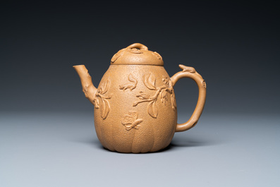 A Chinese Yixing stoneware teapot with squirrels and butterflies, seal mark, 18th C.