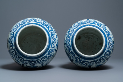 A pair of large Chinese blue and white covered vases, 19th C.