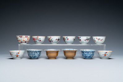 Twenty-two Chinese blue and white and famille rose cups and nineteen saucers, Kangxi and later