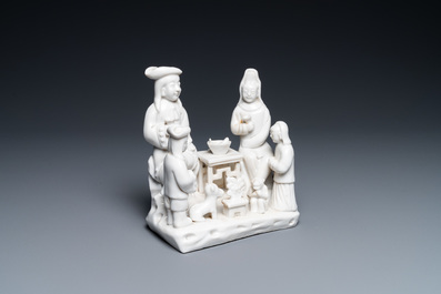 A Chinese Dehua blanc de Chine group of a Dutch family, Kangxi