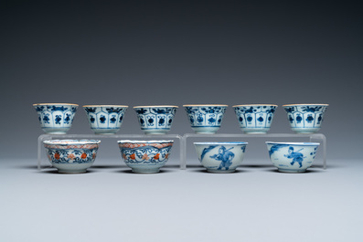 Twenty-two Chinese blue and white and famille rose cups and nineteen saucers, Kangxi and later