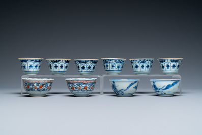 Twenty-two Chinese blue and white and famille rose cups and nineteen saucers, Kangxi and later