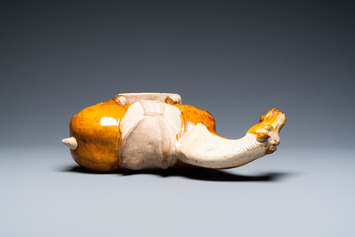 A Chinese amber- and cream-glazed pottery model of a horse, Tang