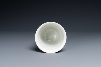 A Chinese white-glazed anhua-decorated 'peony' cup, Xuande mark, Kangxi